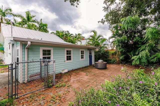 rear view of house featuring a patio