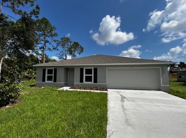 single story home with a front yard and a garage