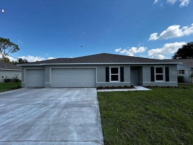 ranch-style home with a front yard and a garage