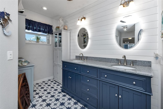 bathroom featuring tile patterned flooring and double vanity