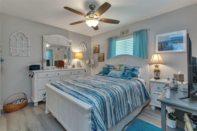 bedroom with light wood-type flooring and ceiling fan