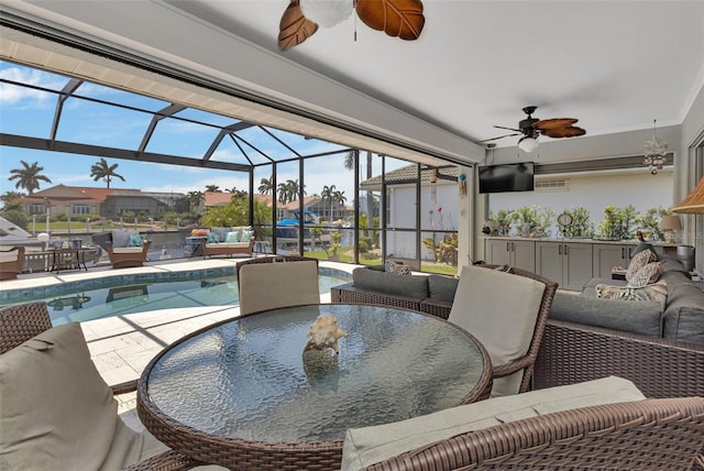 sunroom / solarium with ceiling fan