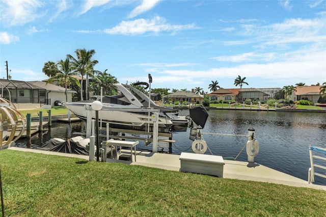 dock area with a yard and a water view