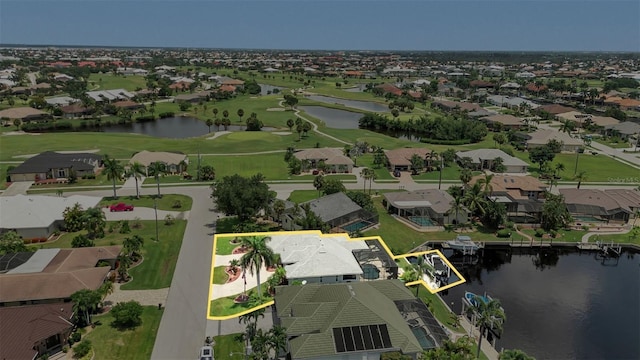 birds eye view of property with a water view