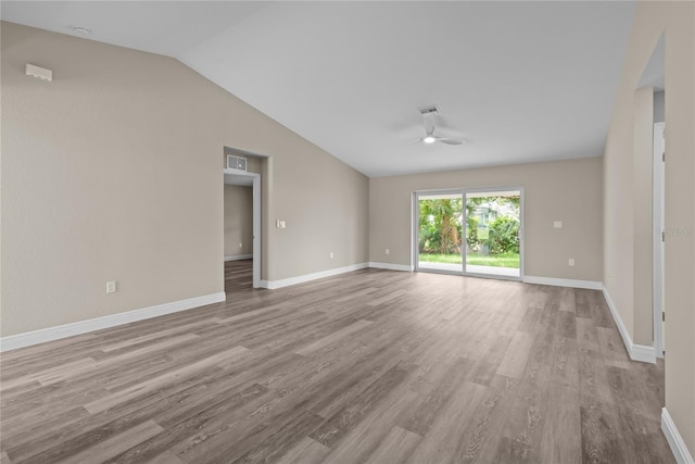 unfurnished room with light hardwood / wood-style floors, vaulted ceiling, and ceiling fan