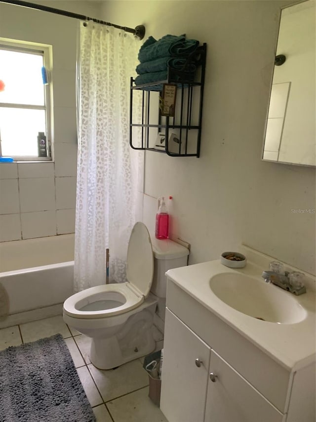 full bathroom featuring toilet, vanity, shower / tub combo with curtain, and tile patterned floors