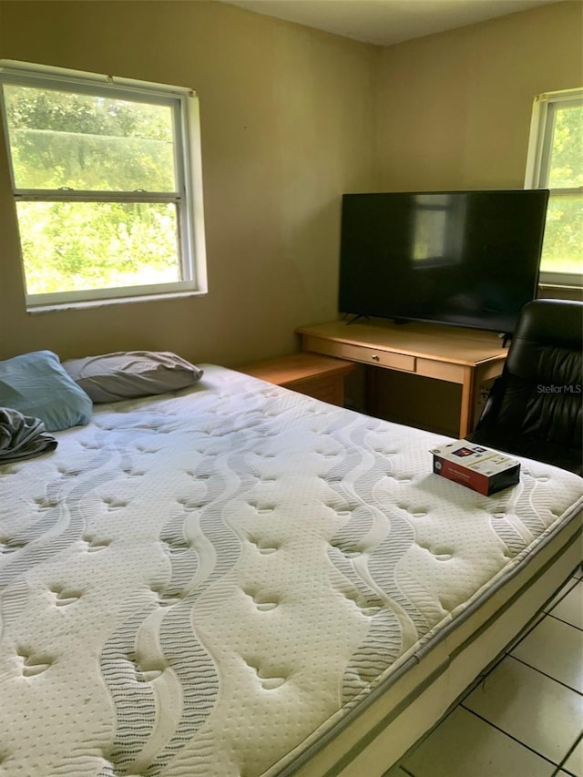 bedroom featuring multiple windows