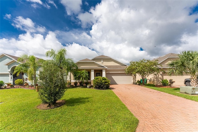 view of front of home with a garage and a front yard