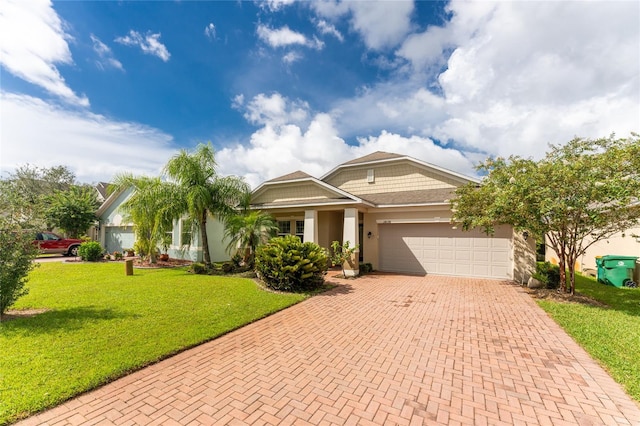 view of front of house with a garage and a front lawn