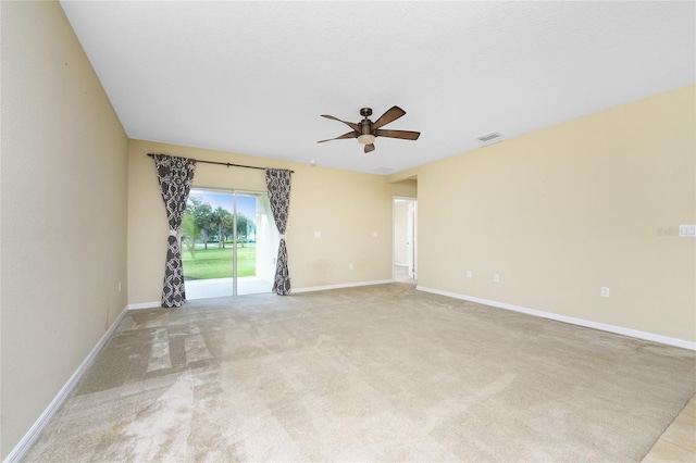 carpeted empty room with ceiling fan