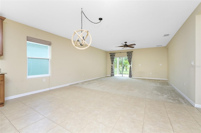 tiled empty room with ceiling fan