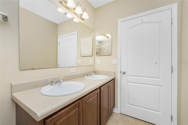 bathroom with tile patterned flooring and vanity