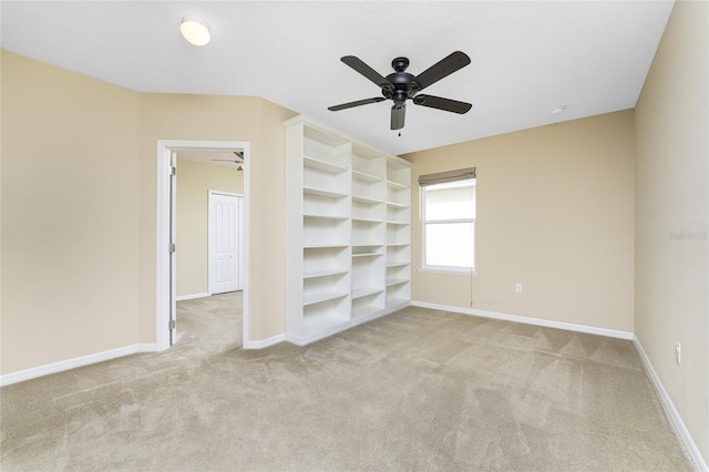 interior space featuring ceiling fan and light colored carpet