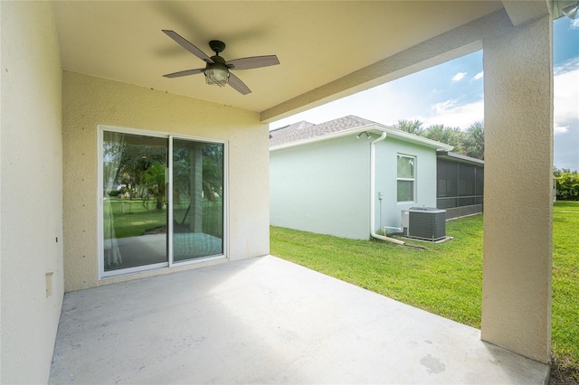 view of patio with ceiling fan and central AC