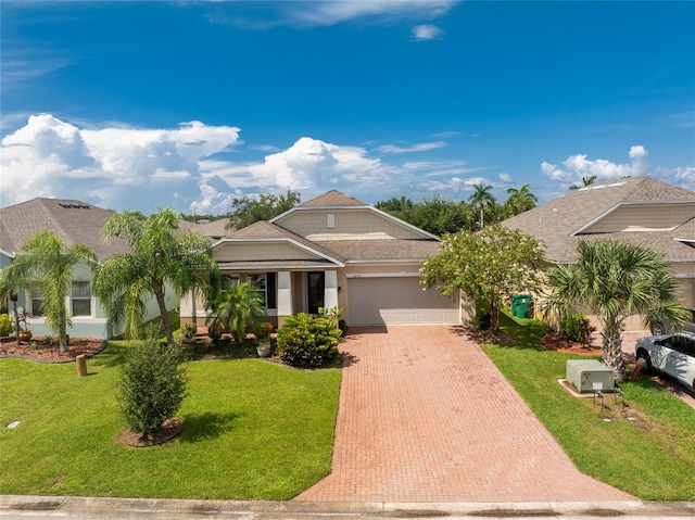 view of front of house featuring a front yard and a garage