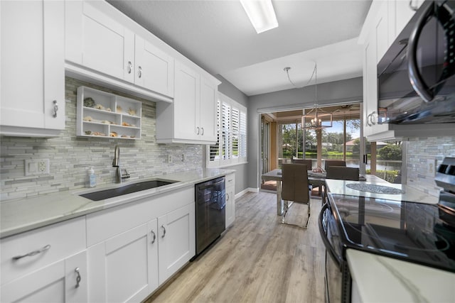 kitchen featuring white cabinetry, sink, range with electric stovetop, and black dishwasher