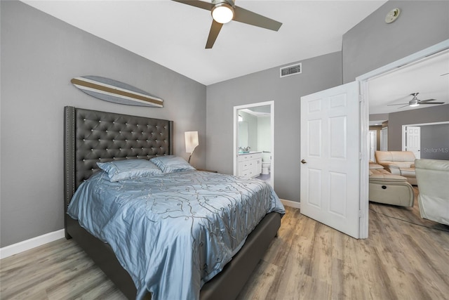 bedroom with wood-type flooring, ensuite bathroom, and ceiling fan