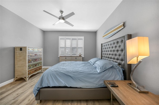 bedroom with ceiling fan and light wood-type flooring