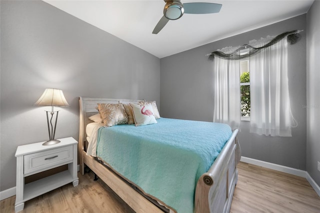 bedroom with ceiling fan and light hardwood / wood-style floors