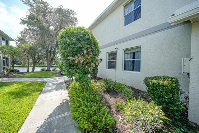 view of side of home featuring a yard