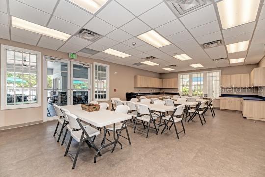 dining room featuring a drop ceiling