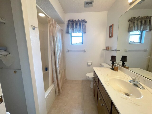 full bathroom with tile patterned floors, a healthy amount of sunlight, shower / bathtub combination with curtain, and a textured ceiling