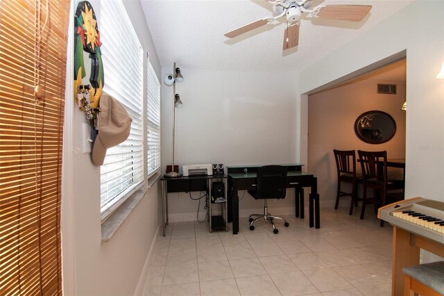 tiled office featuring ceiling fan