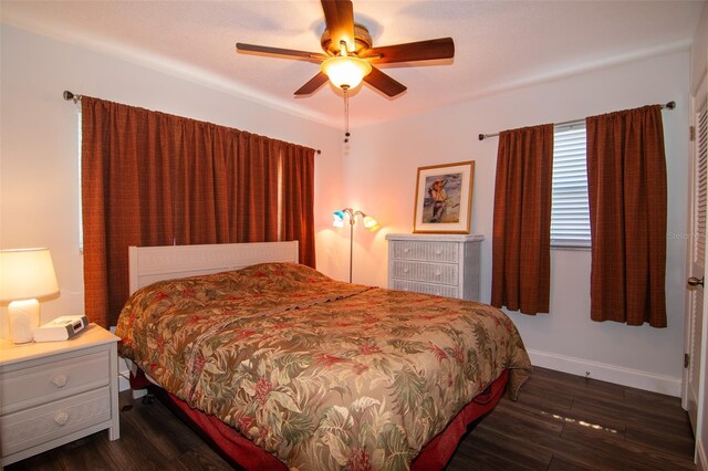 bedroom featuring dark hardwood / wood-style floors and ceiling fan