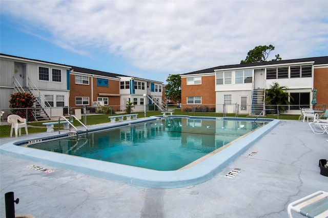 view of swimming pool with a patio area