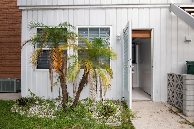 view of exterior entry with central AC unit