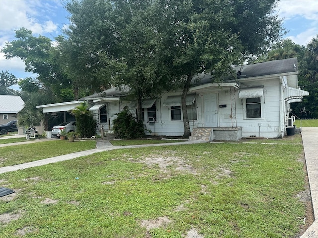 ranch-style house featuring a front yard