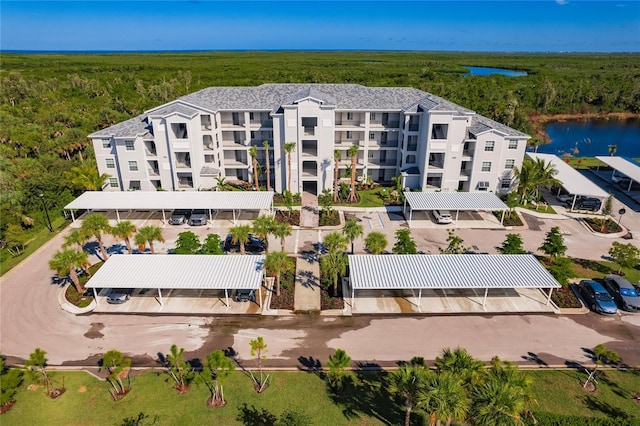 birds eye view of property with a water view