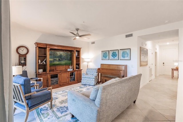 tiled living room with ceiling fan