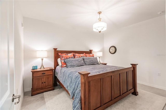 bedroom featuring light tile patterned flooring