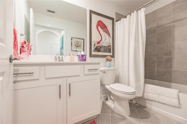 full bathroom featuring shower / bath combination with curtain, toilet, tile patterned floors, and vanity