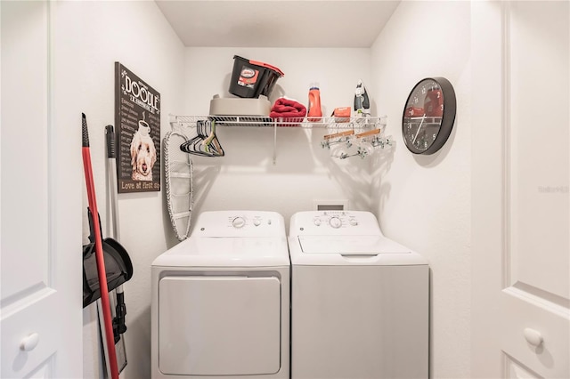 clothes washing area featuring washing machine and dryer