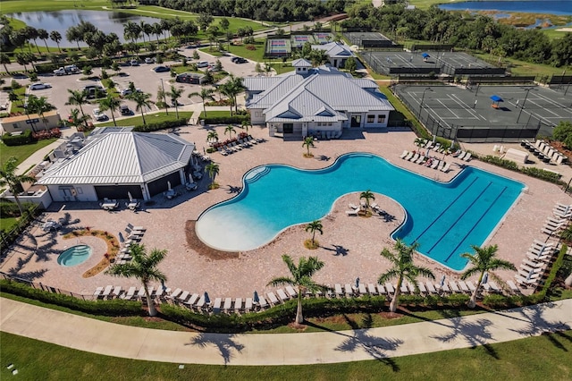 exterior space featuring a patio area and a water view