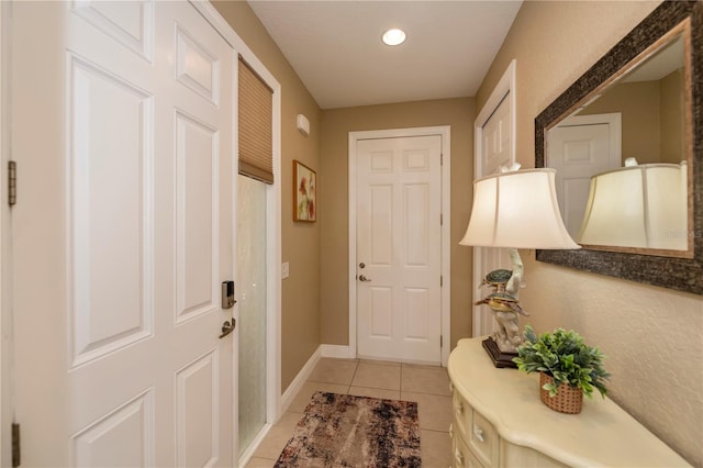 entryway featuring light tile patterned floors