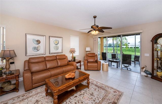 living room featuring ceiling fan and light tile patterned floors