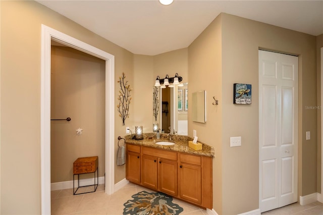 bathroom with tile patterned flooring and vanity