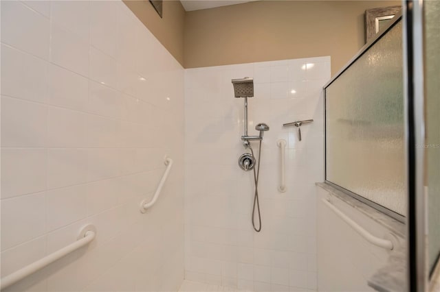 bathroom with tiled shower