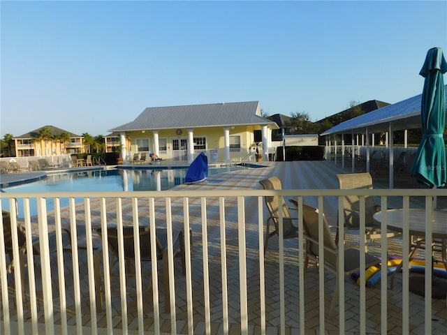 view of swimming pool with a patio area