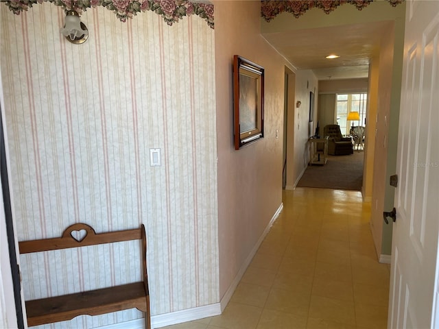 hall featuring light tile patterned floors