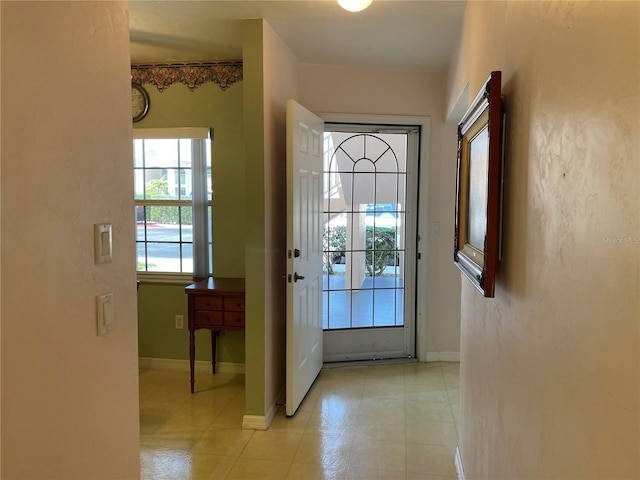 entryway featuring light tile patterned floors