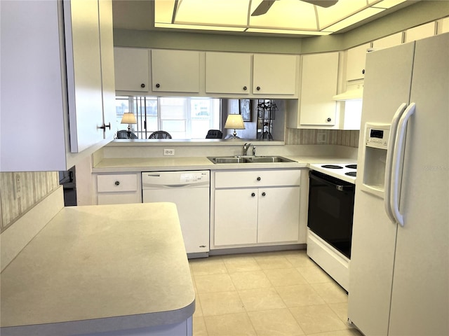 kitchen with sink, light tile patterned floors, white cabinetry, white appliances, and ceiling fan