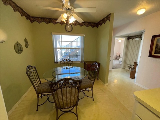 dining room featuring ceiling fan and light tile patterned floors