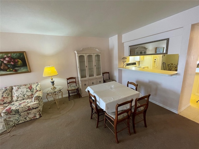 view of carpeted dining area