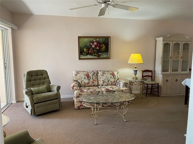 carpeted living room with ceiling fan and a healthy amount of sunlight