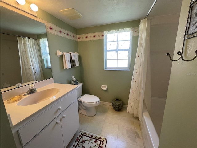 full bathroom featuring tile patterned floors, shower / bath combo with shower curtain, vanity, and toilet