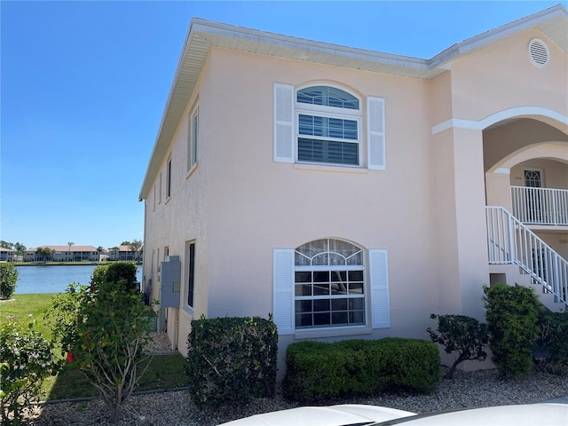 view of home's exterior with a water view